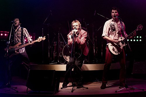 PISTOL -- A first look image from Danny Boyle and FX’s Pistol. Left to right: Christian Lees as original bassist Glen Matlock, Anson Boon as singer John Lydon and Toby Wallace as guitarist Steve Jones. CR: Miya Mizuno/FX